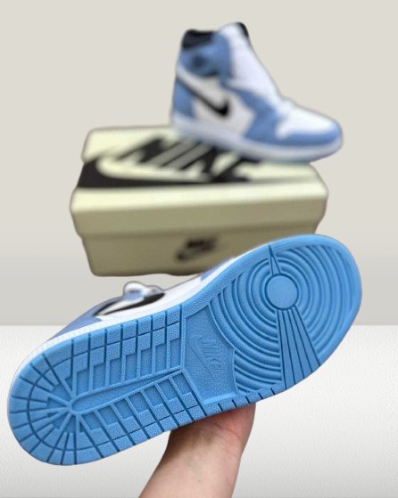 Back view of stylist  Jordan 1 University blue 