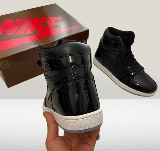 Black Jordan 1 with Space Jam branding on the tongue and heel