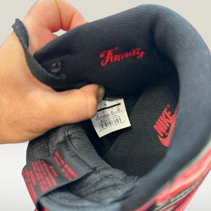 Close-up of the Wings logo on the heel of black-and-red Jordan 1 Patent-Bred sneakers
