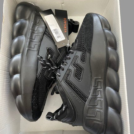 Package of Studio view of Versace Chain Reaction Black Shoes