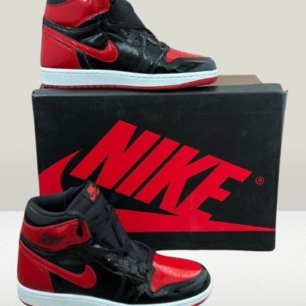 Studio shot of Air Jordan 1 Patent-Bred with Nike box