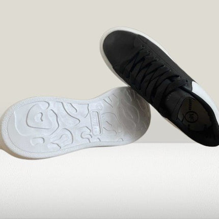 Trendy Alexander McQueen Black sneakers with backside view