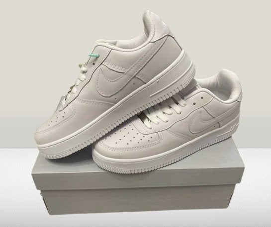 White Nike Air Force 1 sneakers on a clean background
