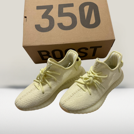 Close-up detail of Yeezy Cream White 350 V2 translucent stripe and distressed sole for urban styling